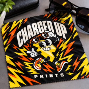 Custom printed microfiber lens and glass wipe next to sunglasses